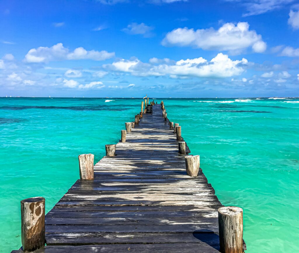 A turquoise Playa Delfines in Cancun with white sands, ideal for value beach travel 2025