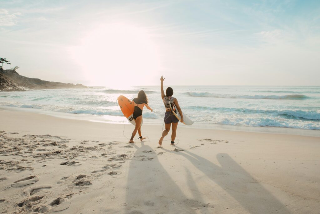 A serene beach horizon at sunset with golden sands and calm waves, showcasing value beach travel 2025