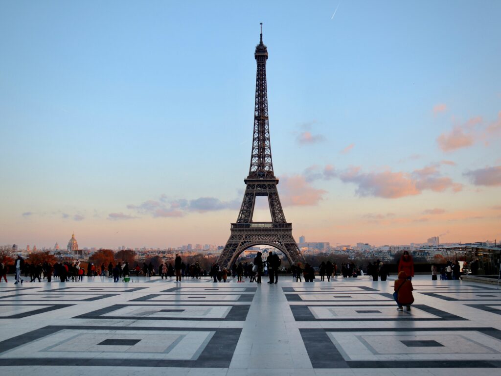 The Eiffel Tower in Paris at sunset with a calm Seine, a gem for value urban travel 2025