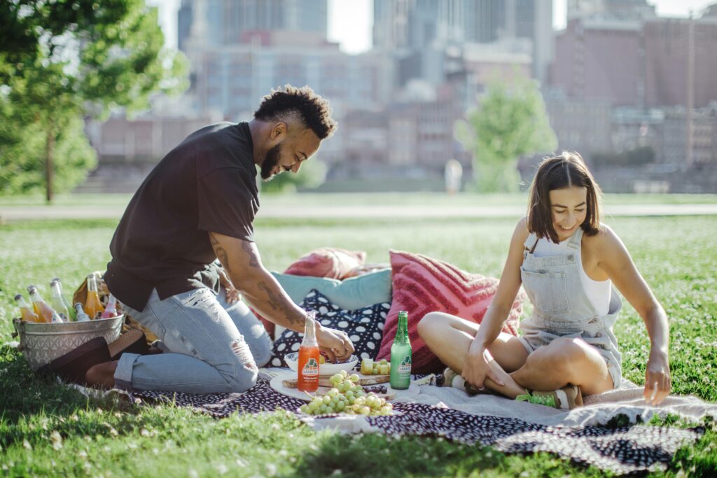 Spring break picnic recipes 2025 couple enjoying blanket picnic