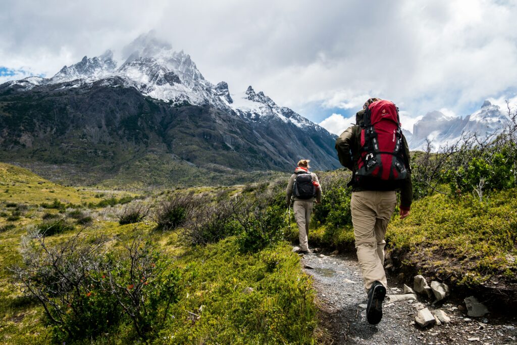 Torres del Paine peaks in Patagonia with a hiker, perfect for value adventure travel 2025.