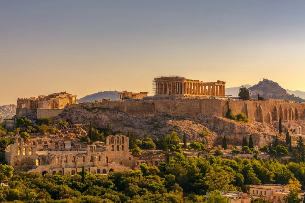 Athens Acropolis and Parthenon glowing against a deep blue sky at dusk