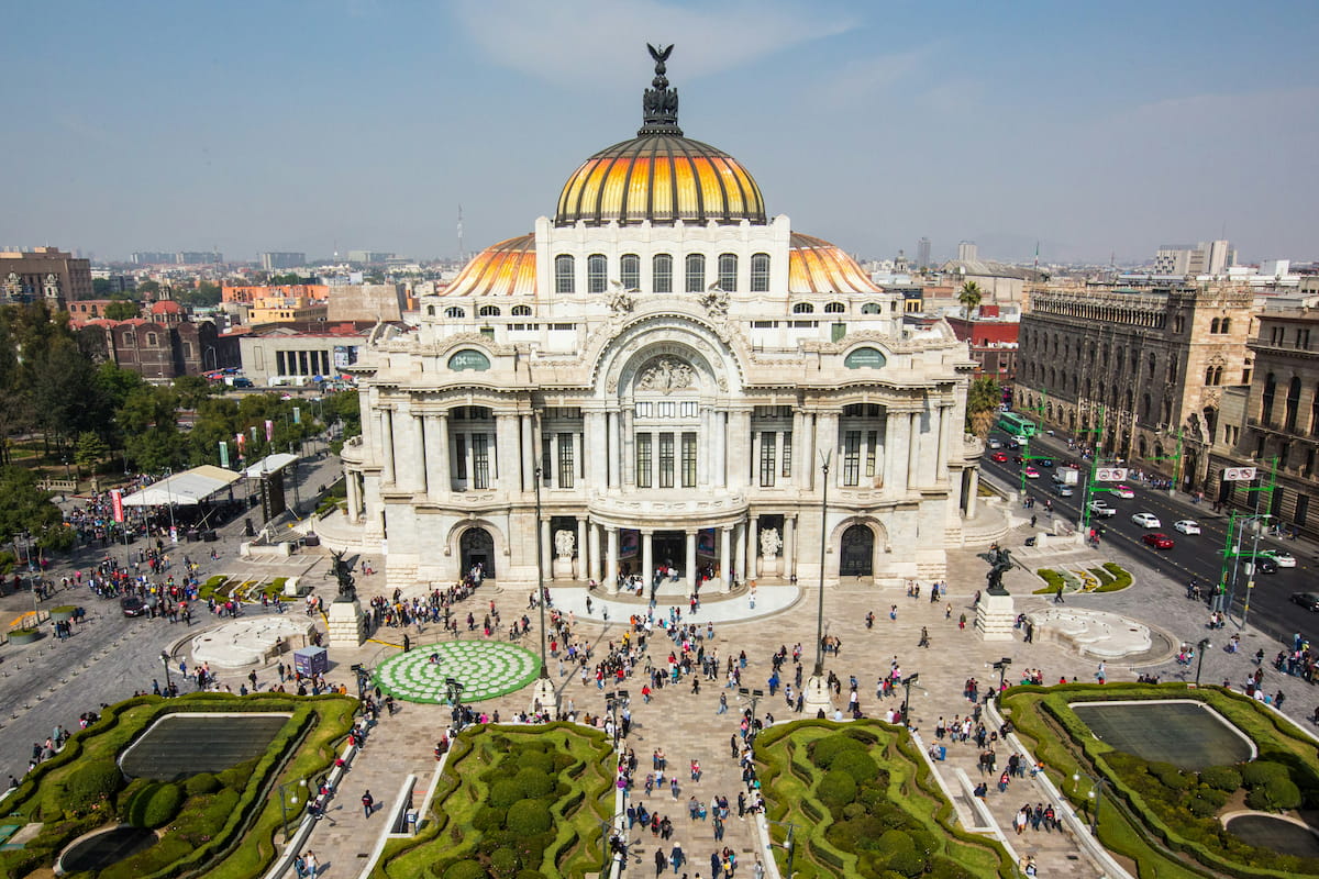 Palacio de Bellas Artes illuminated at night with Art Nouveau dome glowing in Mexico City