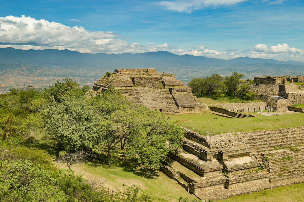 Panoramic view from Monte Albán Zapotec archaeological site with pyramids and the Oaxaca valley stretching below