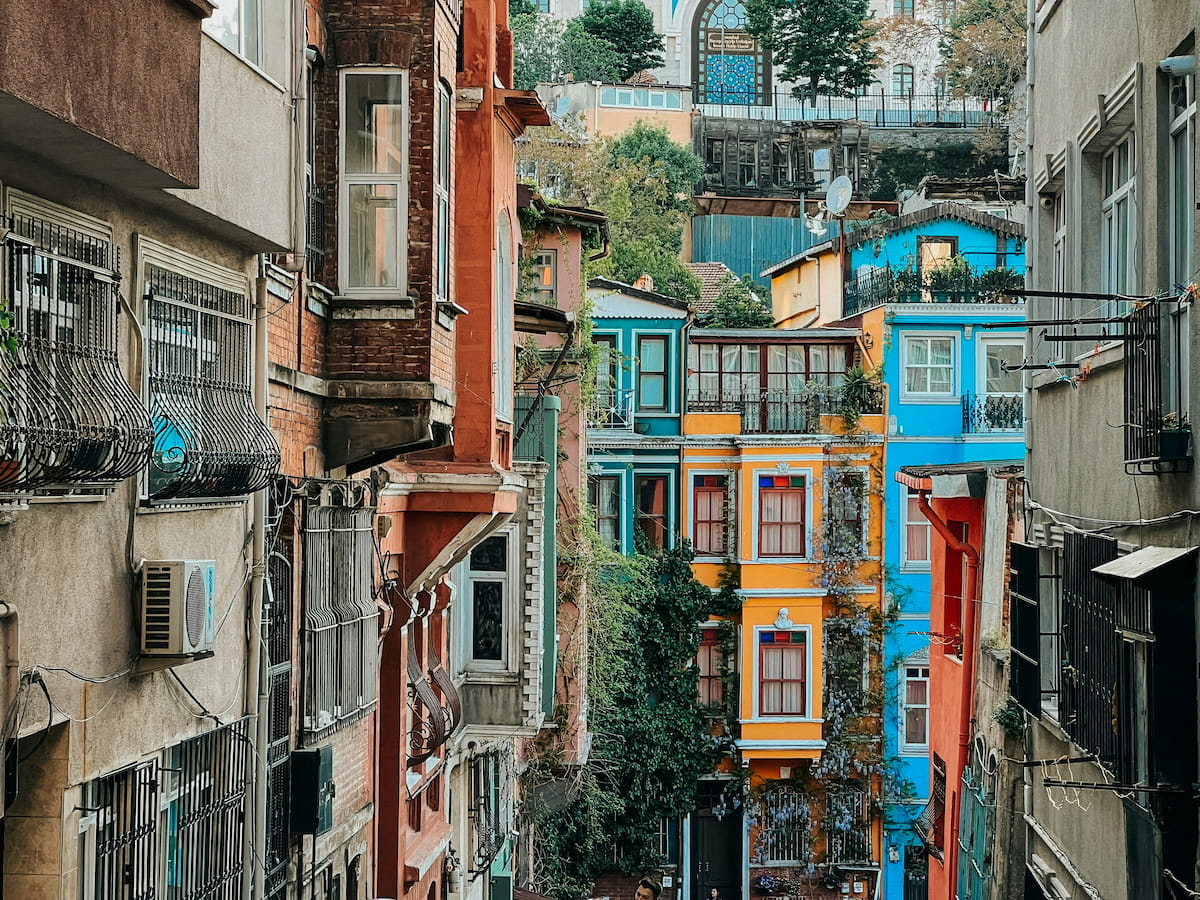 Istanbul Grand Bazaar interior with colorful lanterns, carpets, and vendors