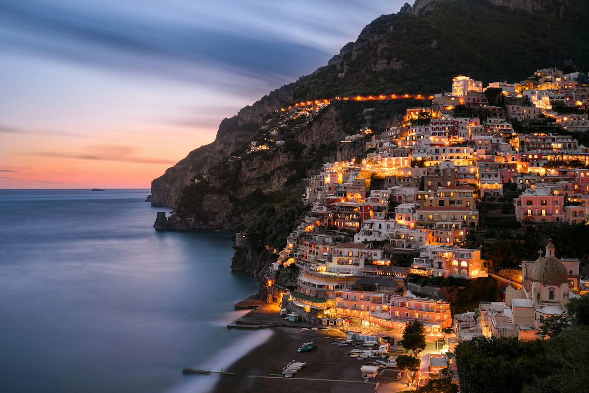 Amalfi Coast cliffside villages glowing at golden hour