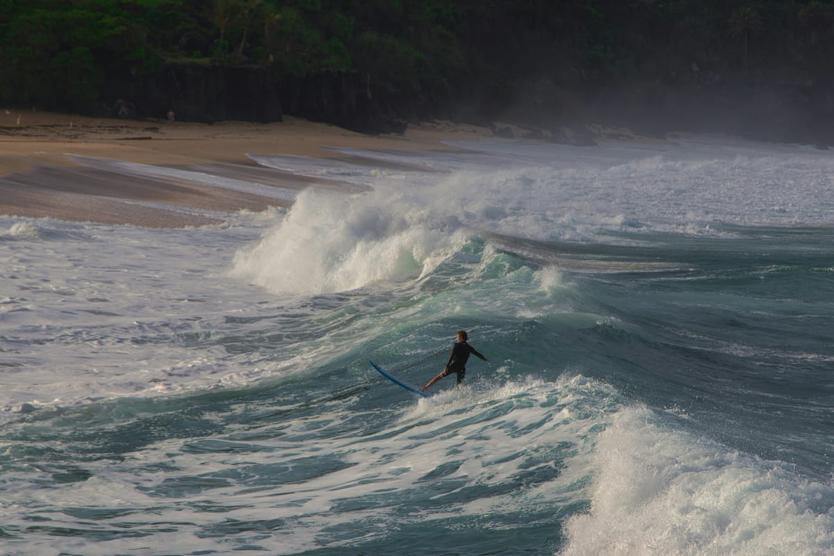 Surfer riding a wave on the North Shore of Oahu, Hawaii