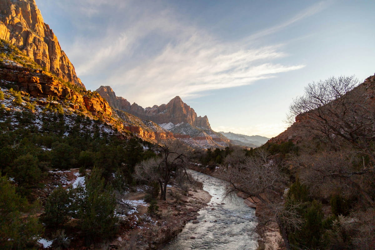 Zion Narrows hikers wading through Virgin River slot canyon