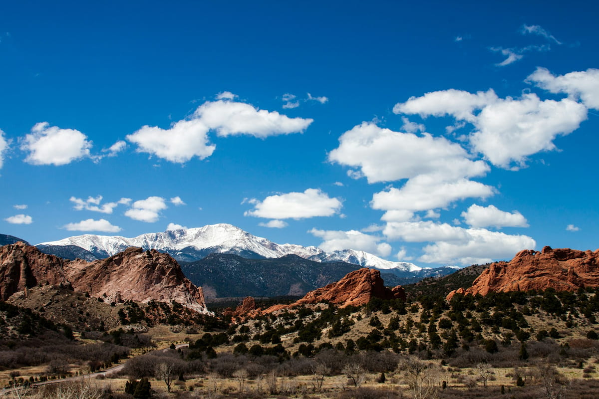 Towering red sandstone formations at Garden of the Gods with Pikes Peak in the background, Colorado Springs