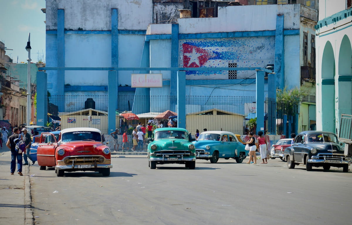 Havana Cuba colorful vintage cars on Malecon seafront promenade