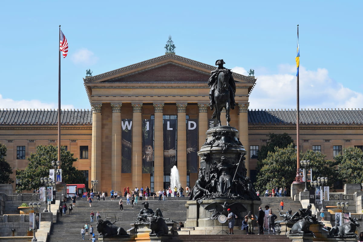 Kids running up the Rocky Steps at the Philadelphia Museum of Art